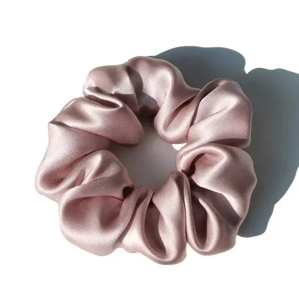 Sky blue 100% pure mulberry silk scrunchie. Large, soft silk hair tie for a smooth and elegant hair styling solution.