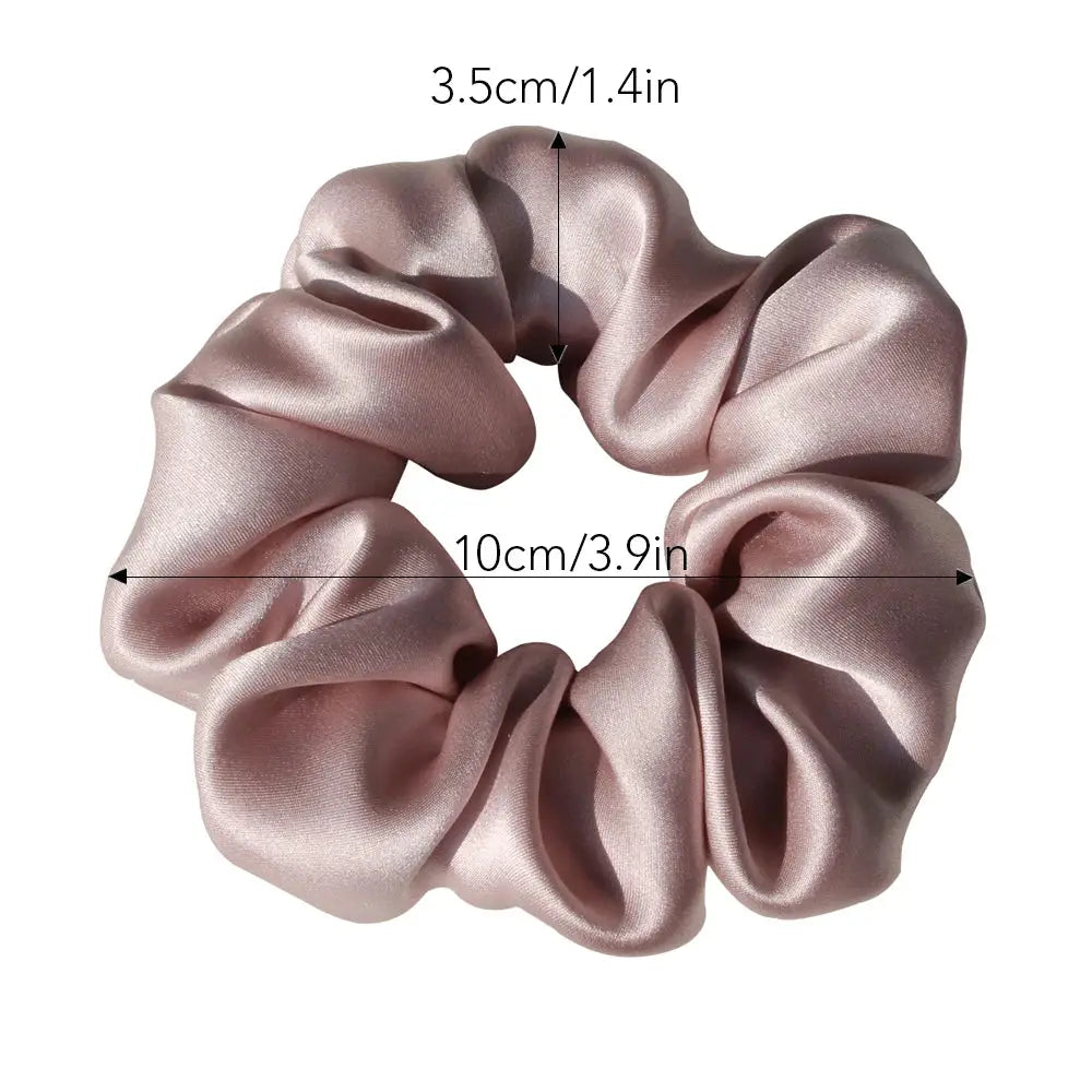Ivory 100% pure mulberry silk scrunchie with a smooth, shiny finish. Large silk hair tie designed for gentle, stylish hair styling.