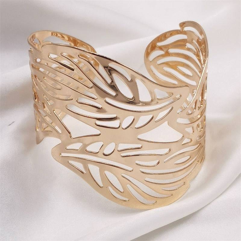 Gold leaf hair cuff with a delicate cut-out pattern, designed for locs, Sisterlocks, and dreadlocks, adding elegance to any hairstyle.