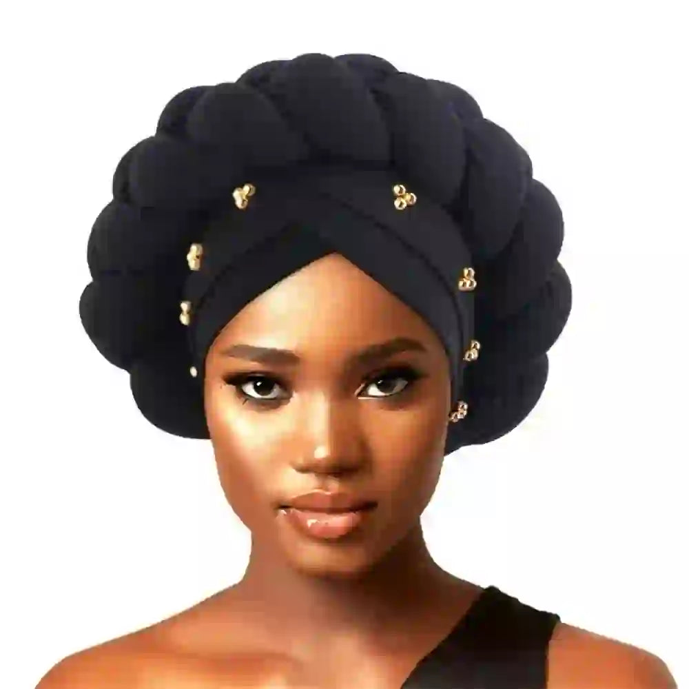 Black Gele African turban for women with intricate braided details and gold bead embellishments. Perfect headwrap for elegant occasions.
