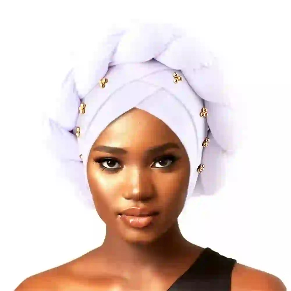 Royal blue Gele African turban with a silver brooch accent for women. A stylish and elegant headwrap for cultural and formal wear.