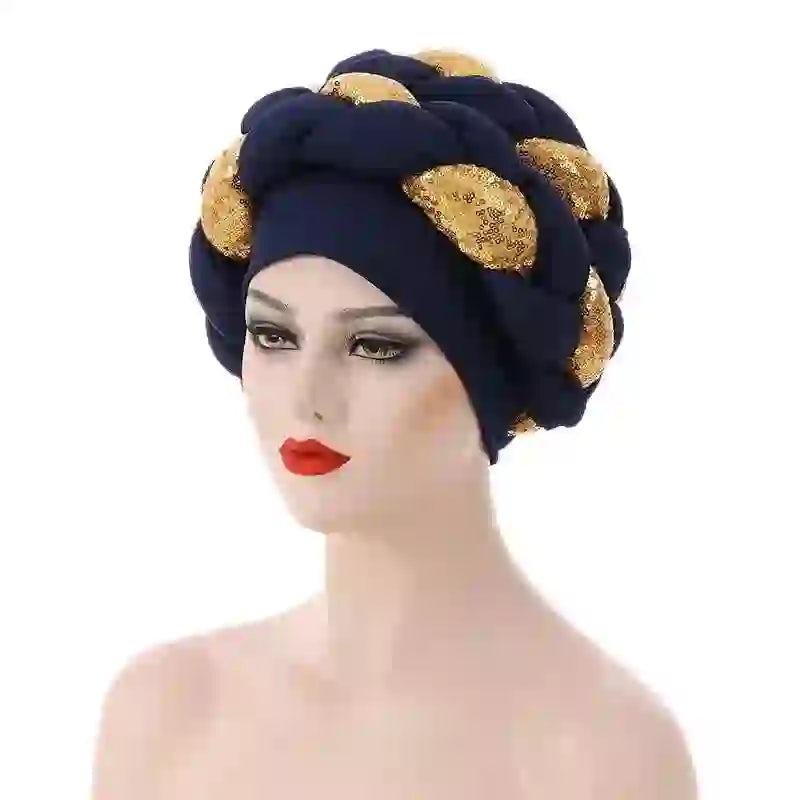 Coral pink Gele African turban with gold sequin embellishments for women. A fashionable and elegant headwrap for special events.