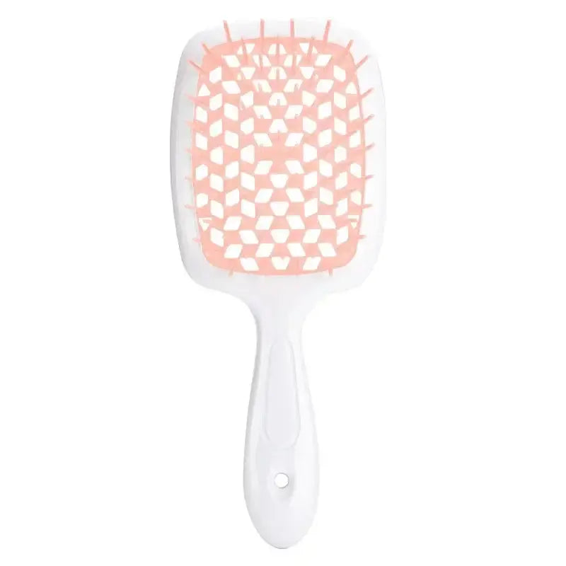 Soft pink detangling brush with red bristles, ideal for curly and 4C hair. Provides a comfortable grip and smooth detangling experience.