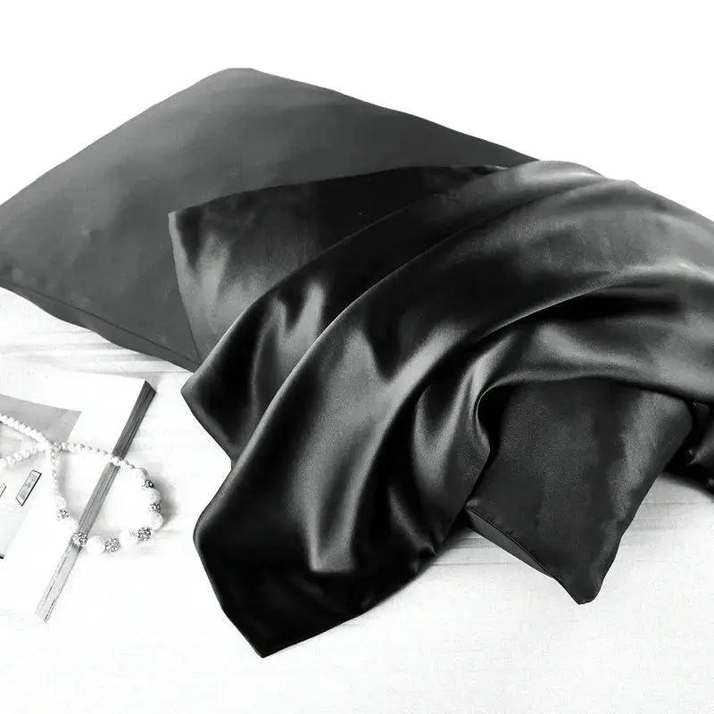 Classic black natural mulberry silk pillowcase for locs. Smooth, breathable, and hypoallergenic for a luxurious and protective sleep experience.