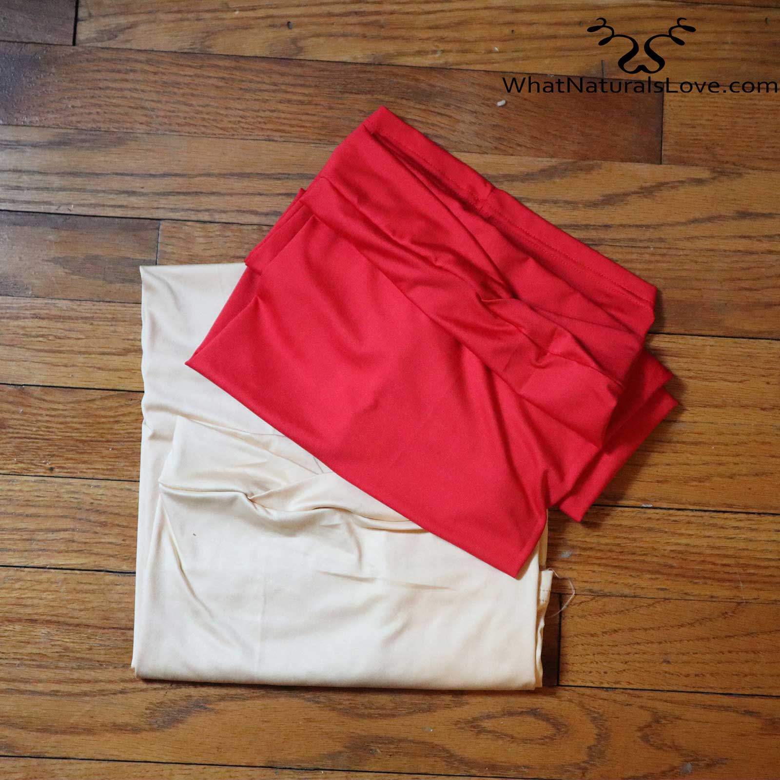 Folded red and beige tube headwraps for locs, sisterlocks, and dreadlocks. Soft and stylish headwear for natural hair.