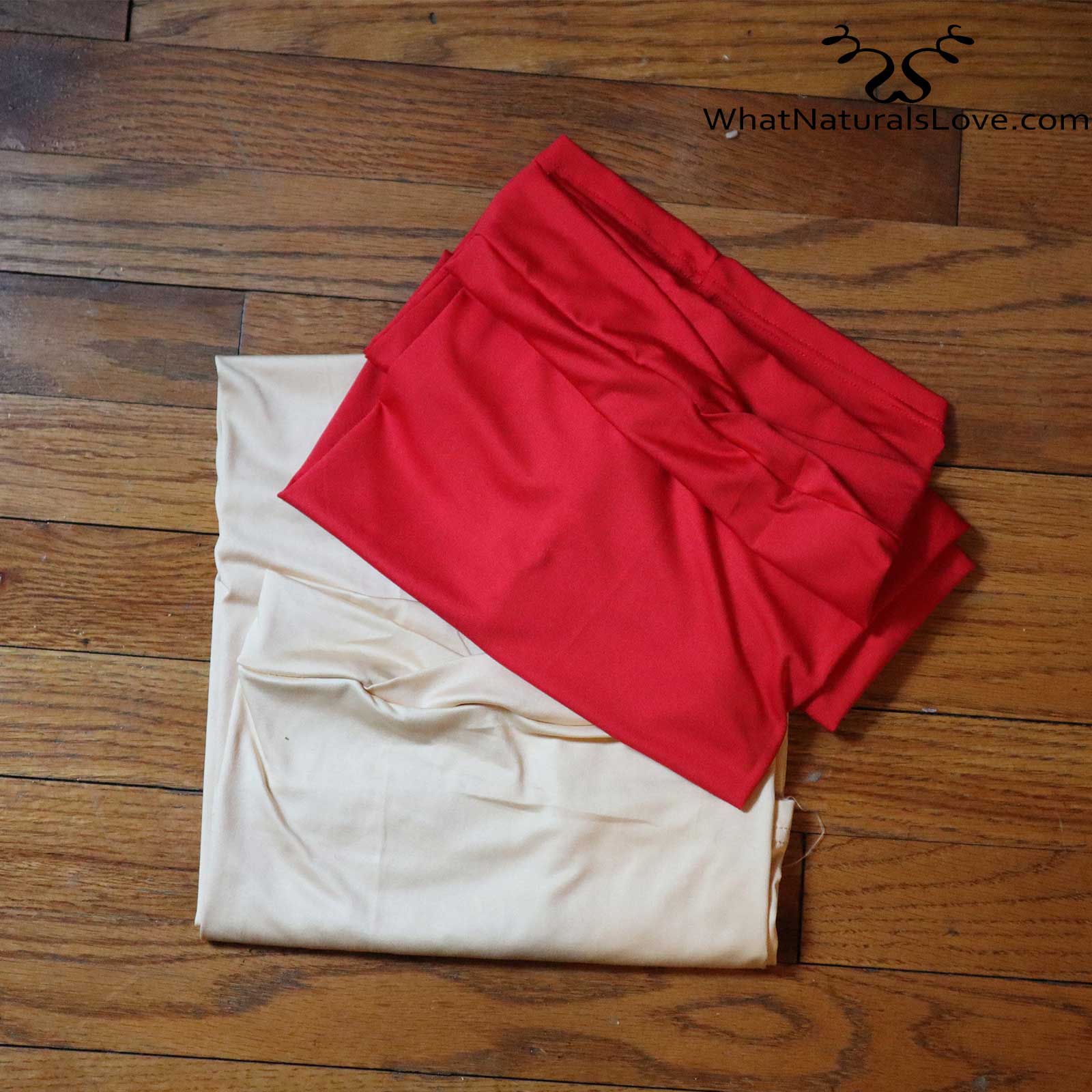 Folded red and beige tube headwraps for locs, sisterlocks, and dreadlocks. Soft and stylish headwear for natural hair.