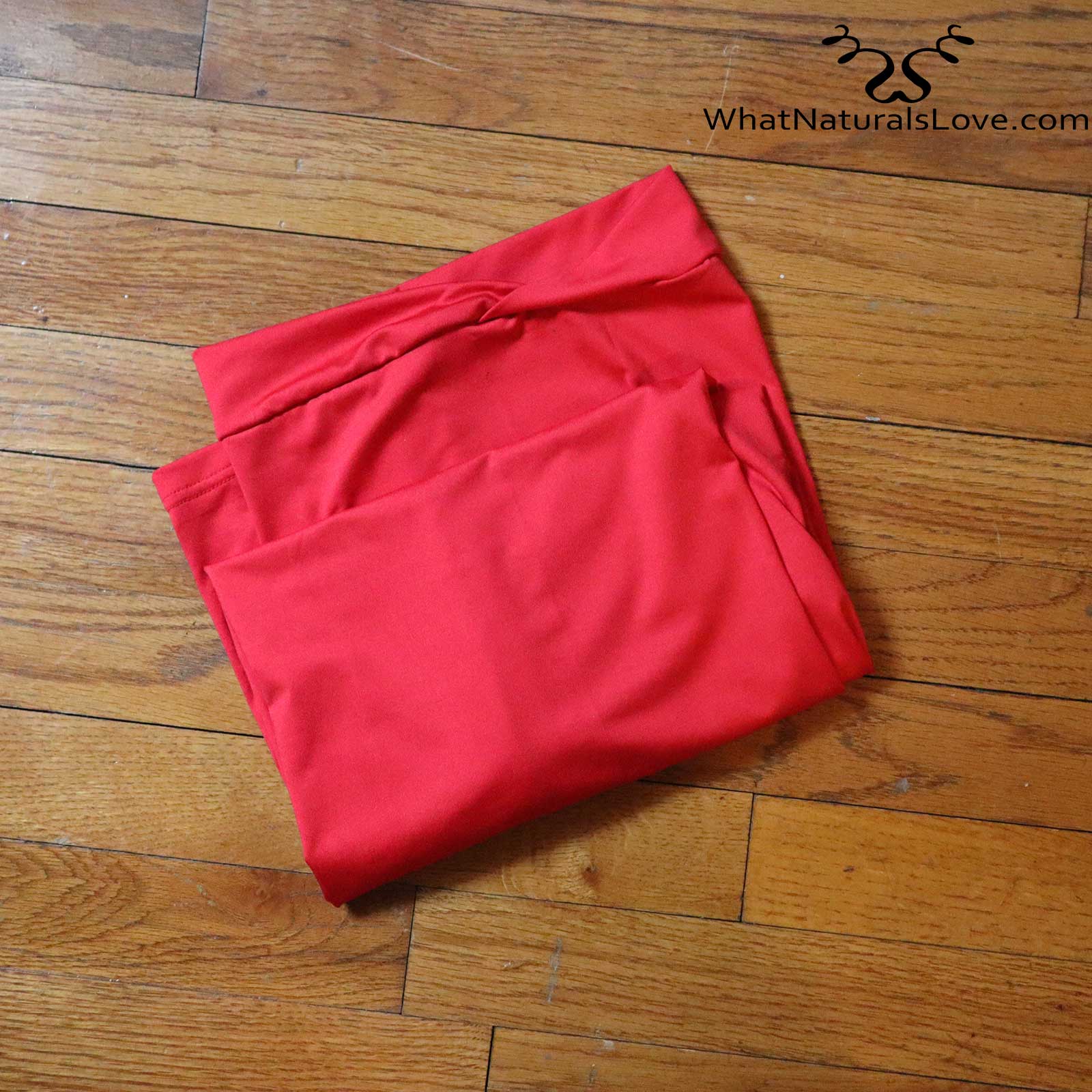 Folded red tube headwrap for locs, sisterlocks, and dreadlocks. A vibrant and stylish hair accessory for any occasion.