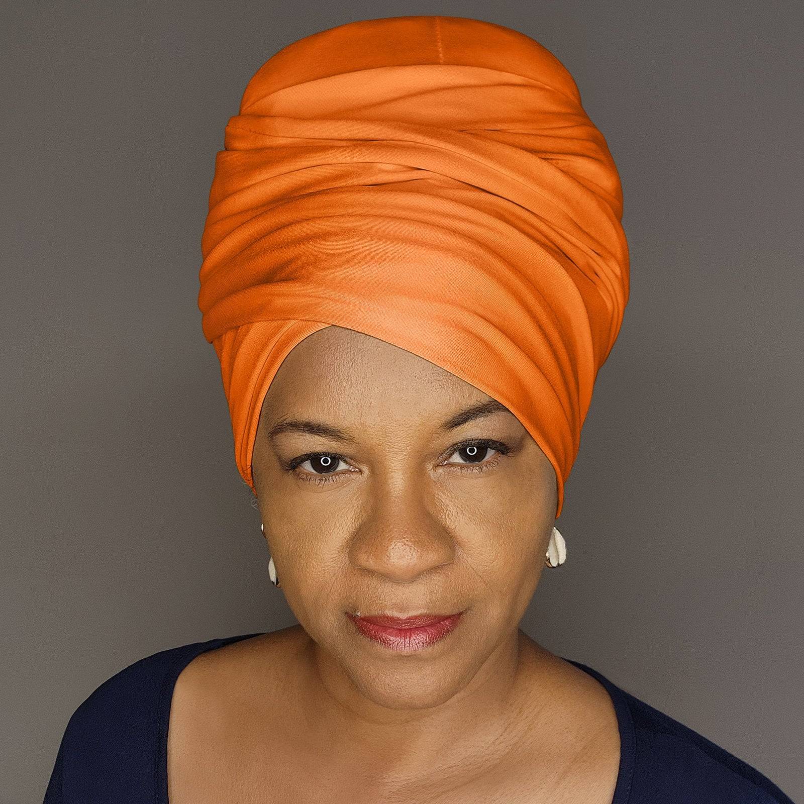 Vibrant orange tube headwrap for locs, sisterlocks, and dreadlocks. A fashionable and protective hair accessory for any occasion.