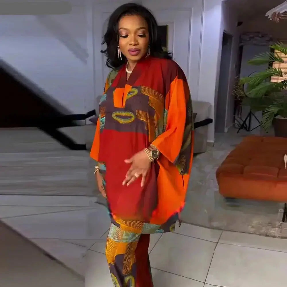 Stylish and comfortable pants set with a vibrant orange and multicolor design, perfect for a bold fashion statement.