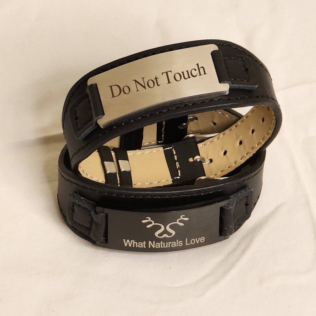 Stacked leather bracelets featuring &