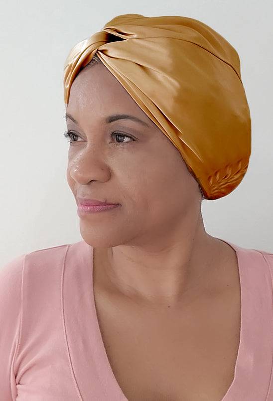 Silk Bonnet Amara De Luxe in golden yellow, crafted from 100% Mulberry Silk. A stylish and protective headwrap for locs and natural hair.