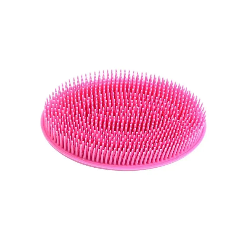 Compact pink silicone loc lint remover brush, designed for effective lint removal from locs without damaging hair strands.