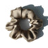 Blush pink 100% pure mulberry silk scrunchie with a soft, shiny texture. Large silk hair tie for a gentle and stylish hair accessory.