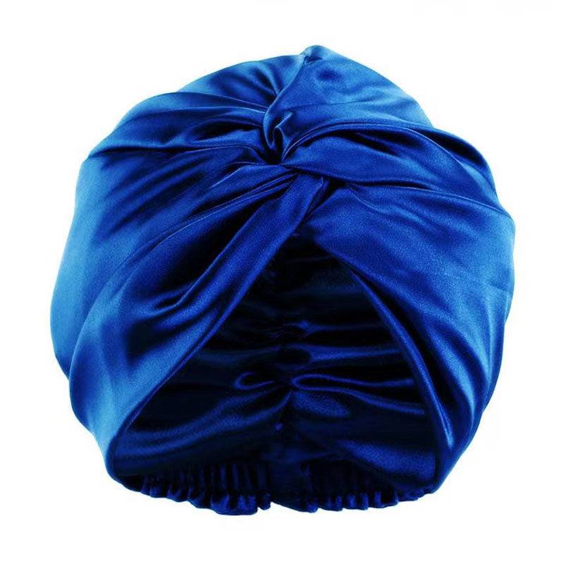 Silk Bonnet Amara De Luxe in royal blue, featuring a twisted front design. Made from 100% Mulberry Silk for hair care and moisture retention.
