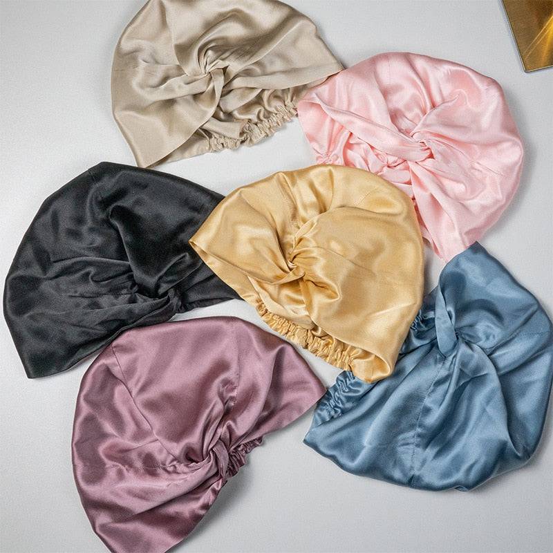 Collection of Silk Bonnet Amara De Luxe in various colors, made from 100% Mulberry Silk. Perfect for protecting locs and natural hair.