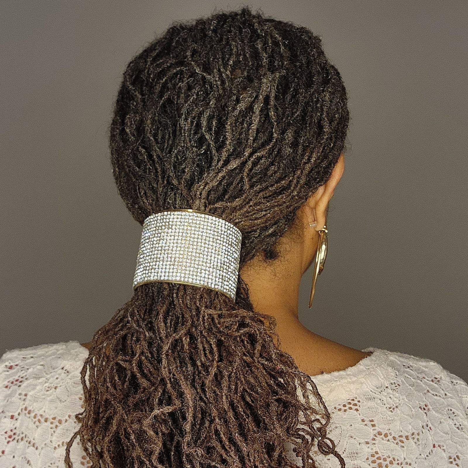 Elegant crystal hair cuff securing locs in a ponytail. A stylish and non-damaging accessory for locs, braids, and twists.