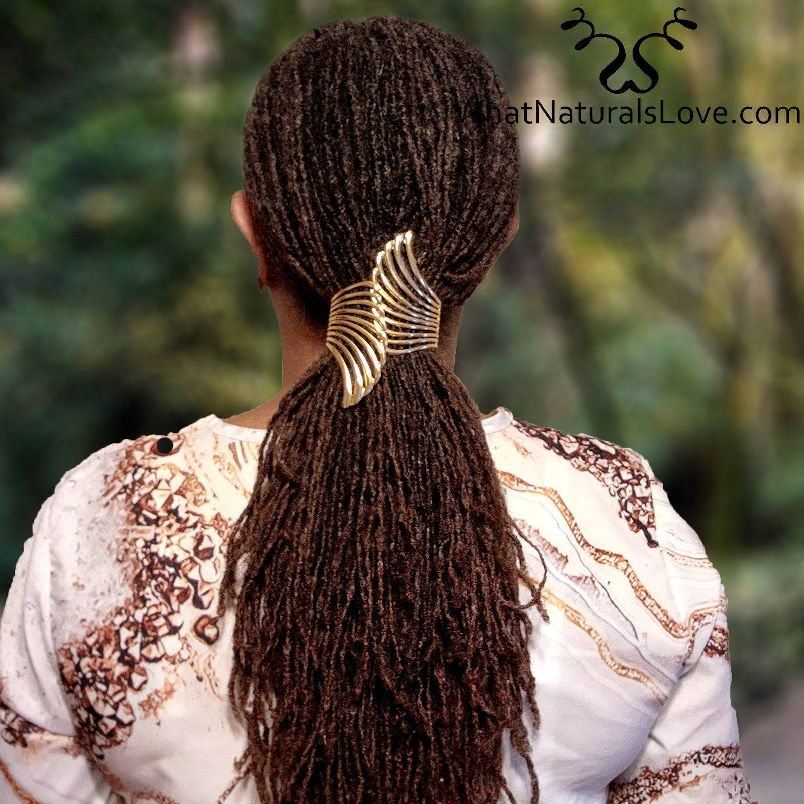 Gold Aurora Wing Cuff securing long sisterlocks in a ponytail. Elegant and non-damaging hair accessory for locs, dreadlocks, and braids.