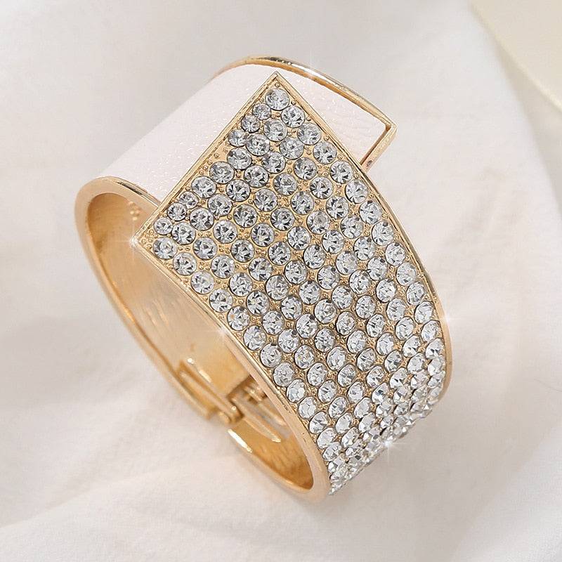 White and gold rhinestone hair cuff with a sleek design. Ideal for securing locs, dreadlocks, braids, and curls elegantly.
