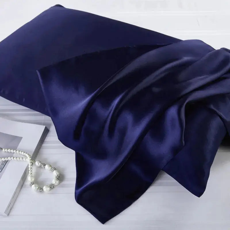 Deep navy blue natural mulberry silk pillowcase for locs. Ultra-soft, breathable, and designed to protect hair from frizz and breakage.