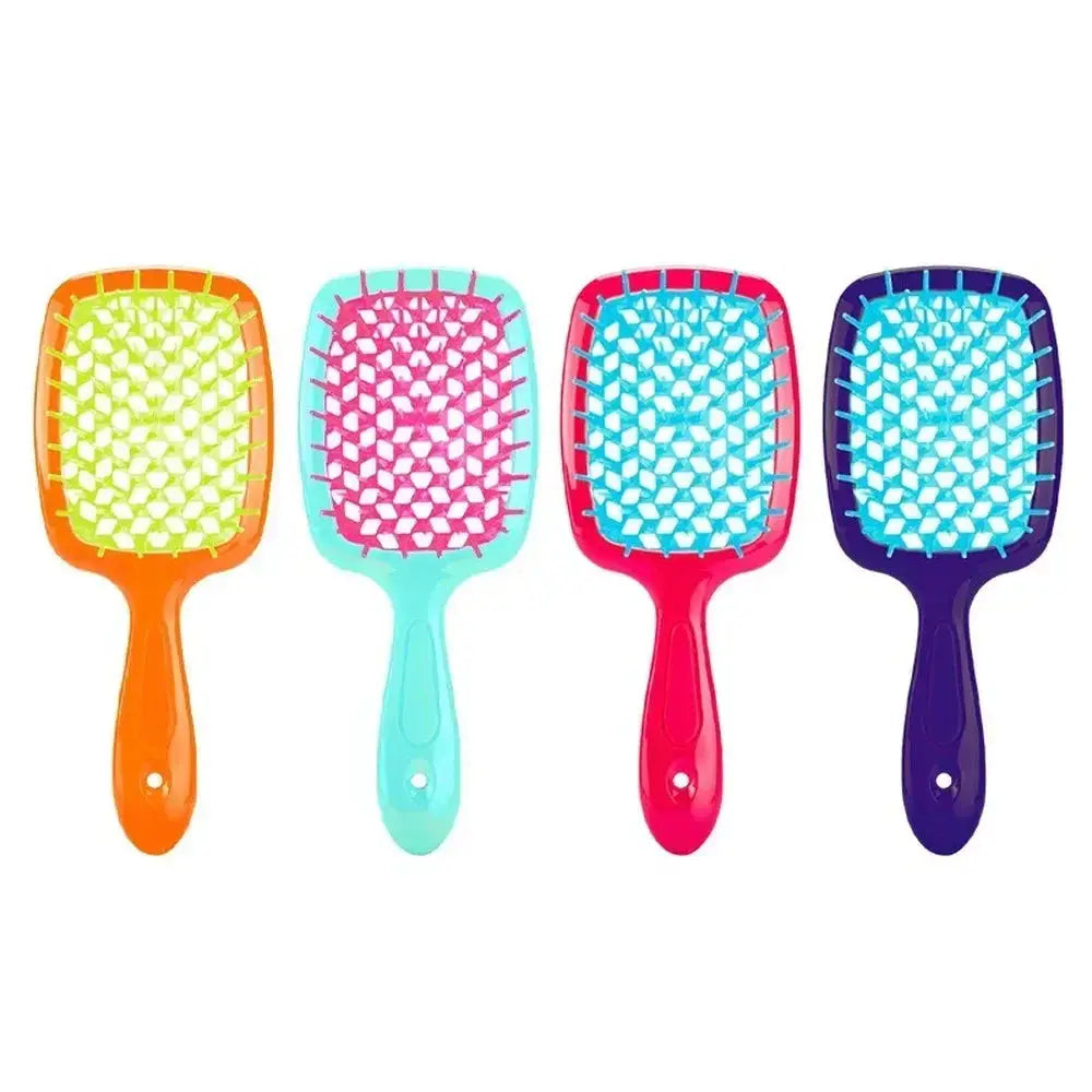 Turquoise detangling brush with pink bristles. Perfect for curly and 4C hair, reducing breakage and ensuring smooth styling.