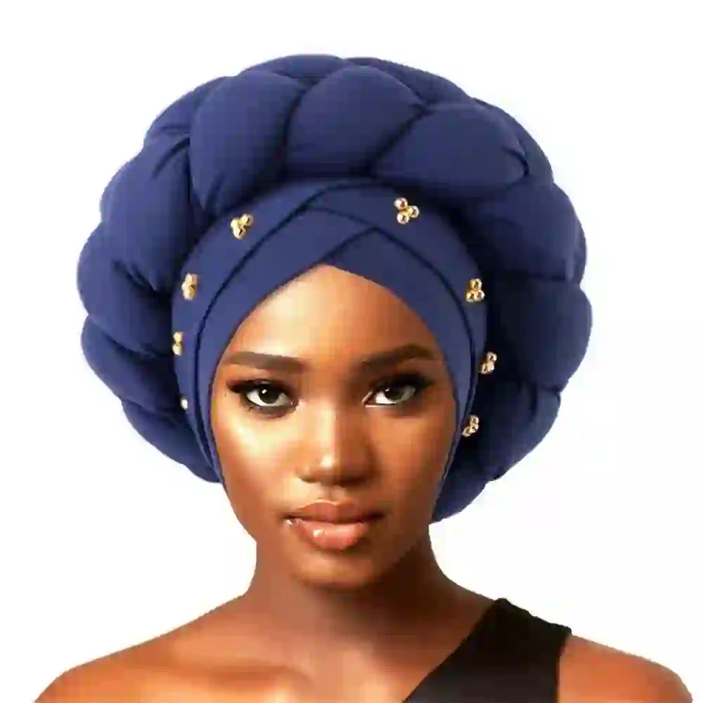 Mustard yellow Gele African turban with gold sequin details for women. A stylish and elegant headwrap for cultural and formal events.