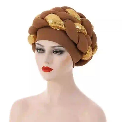 Navy blue Gele African turban for women with braided design and gold bead embellishments. Elegant headwrap for traditional and modern styling.