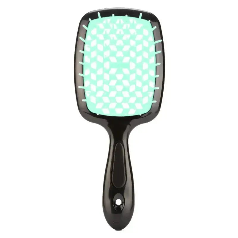 White detangling brush with black bristles, ideal for curly and 4C hair. Provides a comfortable grip and smooth detangling experience.