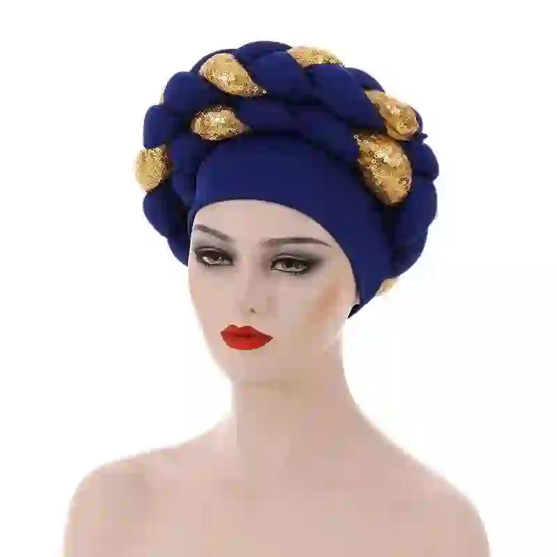 Wine red Gele African turban with gold sequin details for women. A luxurious headwrap for cultural and formal events.