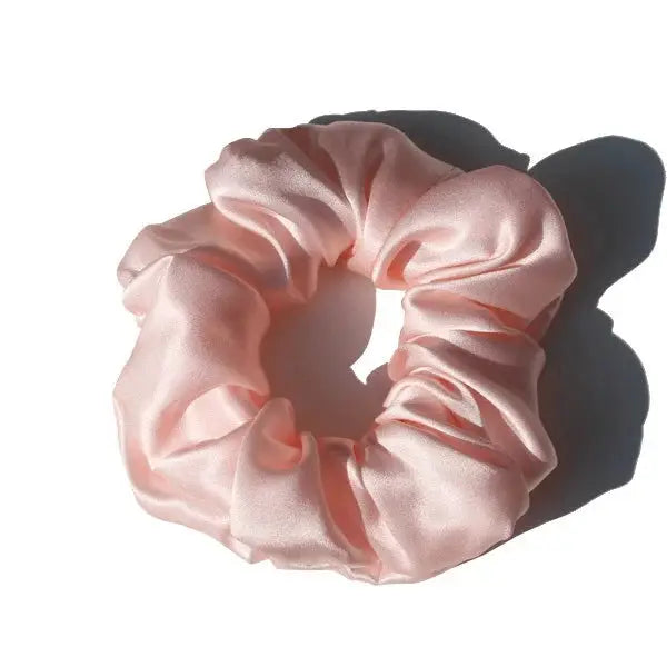 Lavender purple 100% pure mulberry silk scrunchie. Large, soft silk hair tie for a smooth and elegant hair styling option.