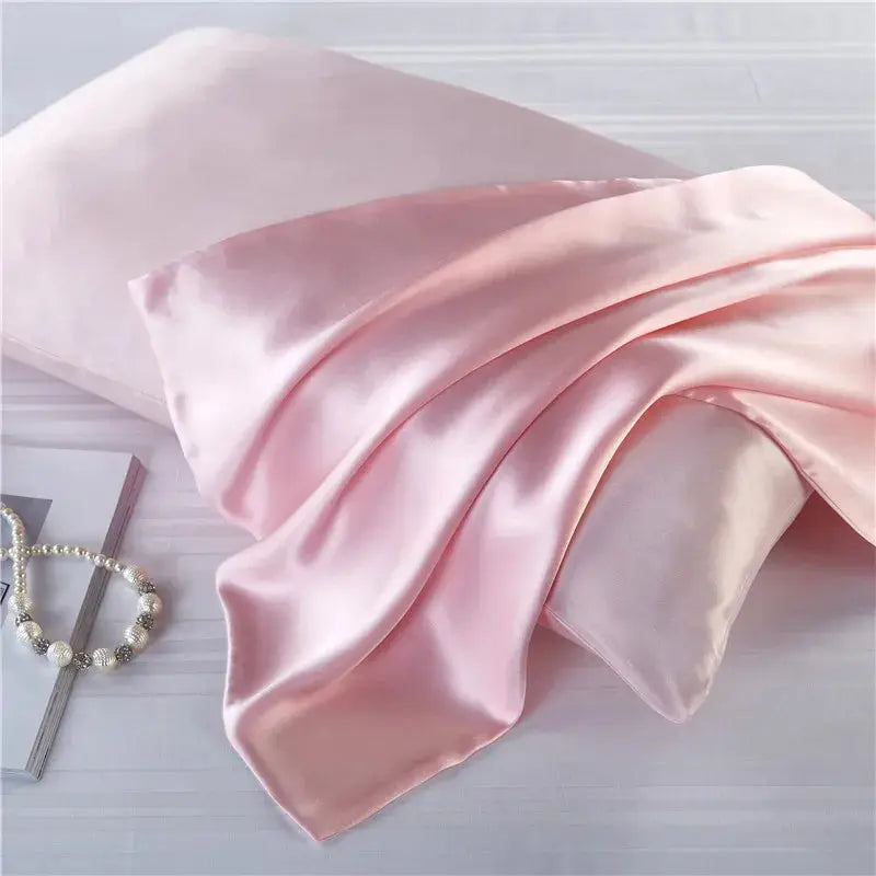 Blush pink natural mulberry silk pillowcase for locs. Ultra-soft, breathable, and designed to protect hair from frizz and breakage.