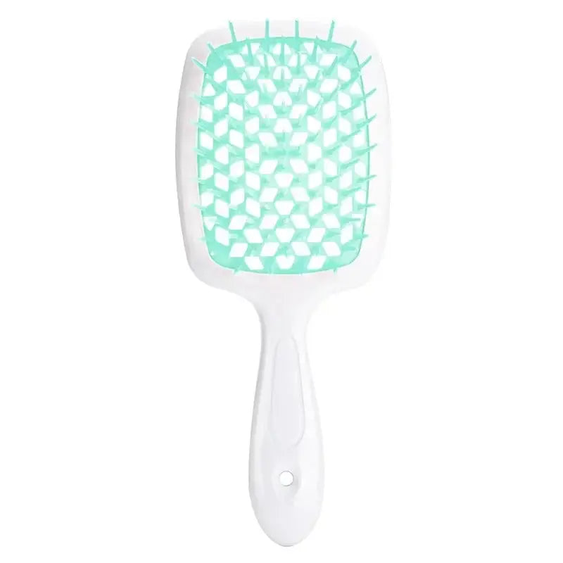 Green detangling brush with a honeycomb bristle structure for curly hair. Provides a comfortable grip and smooth detangling experience.