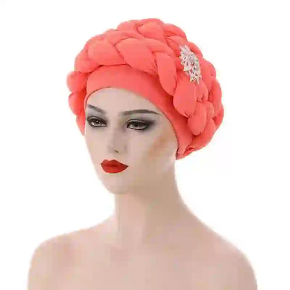 Wine red Gele African turban with a silver brooch accent for women. A luxurious and elegant headwrap for formal events.