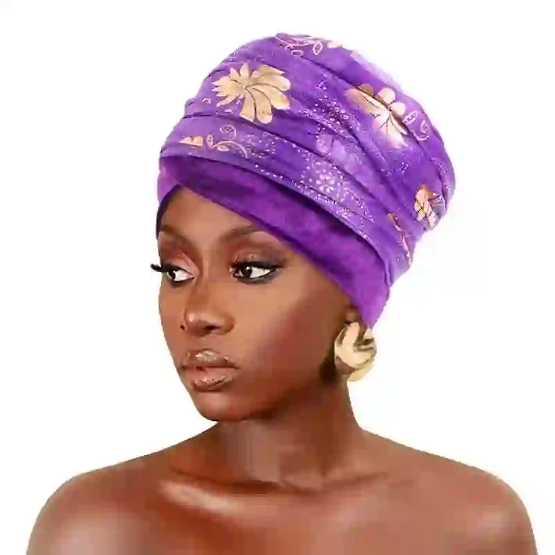 Regal Amethyst Adorned Headwrap in vibrant purple with gold floral patterns, elegantly styled on a model. Perfect for women seeking a chic headwear option.
