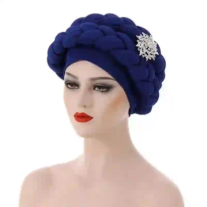 Navy blue Gele African turban with a silver brooch accent for women. A luxurious and elegant headwrap for special occasions.