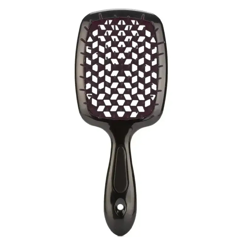 Bright orange detangling brush with neon green bristles, ideal for curly and 4C hair. Provides a comfortable grip and smooth detangling experience.
