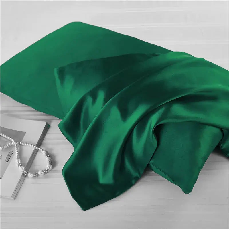 Emerald green natural mulberry silk pillowcase for locs. Smooth, breathable, and hypoallergenic for a luxurious and protective sleep experience.