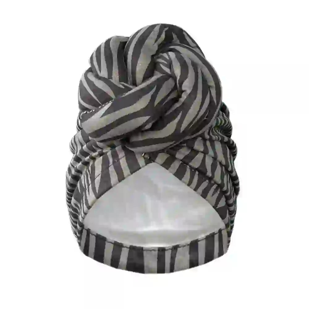 Close-up of a black and gray striped patterned knot turban headwrap, designed for soft comfort and elegant styling.