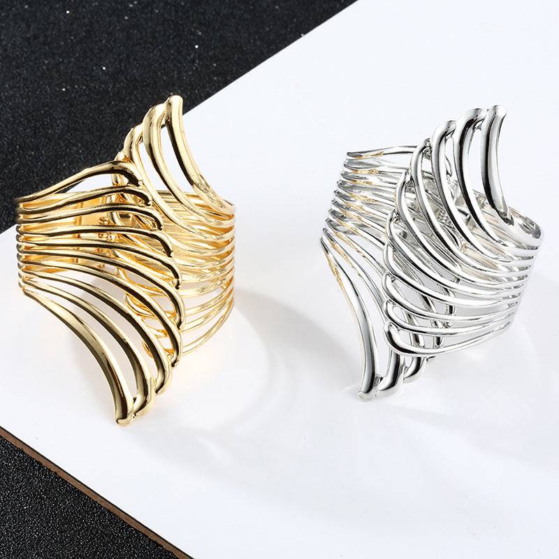 Gold and Silver Aurora Wing Cuffs side by side, showcasing their elegant wing-shaped design. Perfect for styling locs, dreadlocks, and braids.