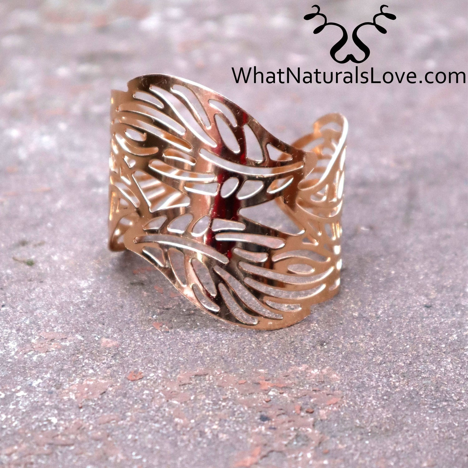 Close-up of a gold leaf hair cuff for locs, featuring an intricate cut-out design, ideal for dreadlocks, Sisterlocks, and stylish hair accessories.