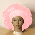 Super Comfi Large Satin Bonnet for Locs in soft pink on a mannequin. Satin-lined, tie-on bonnet keeps hair moisturized and secure overnight.