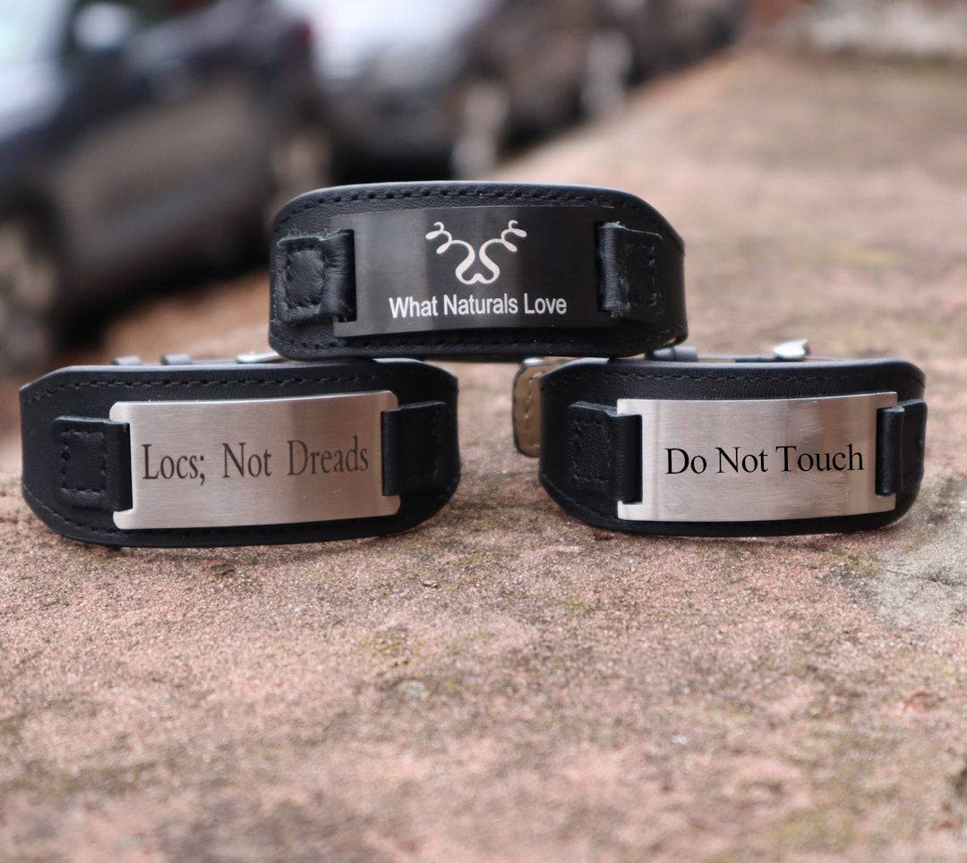 Set of three black leather bracelets with &