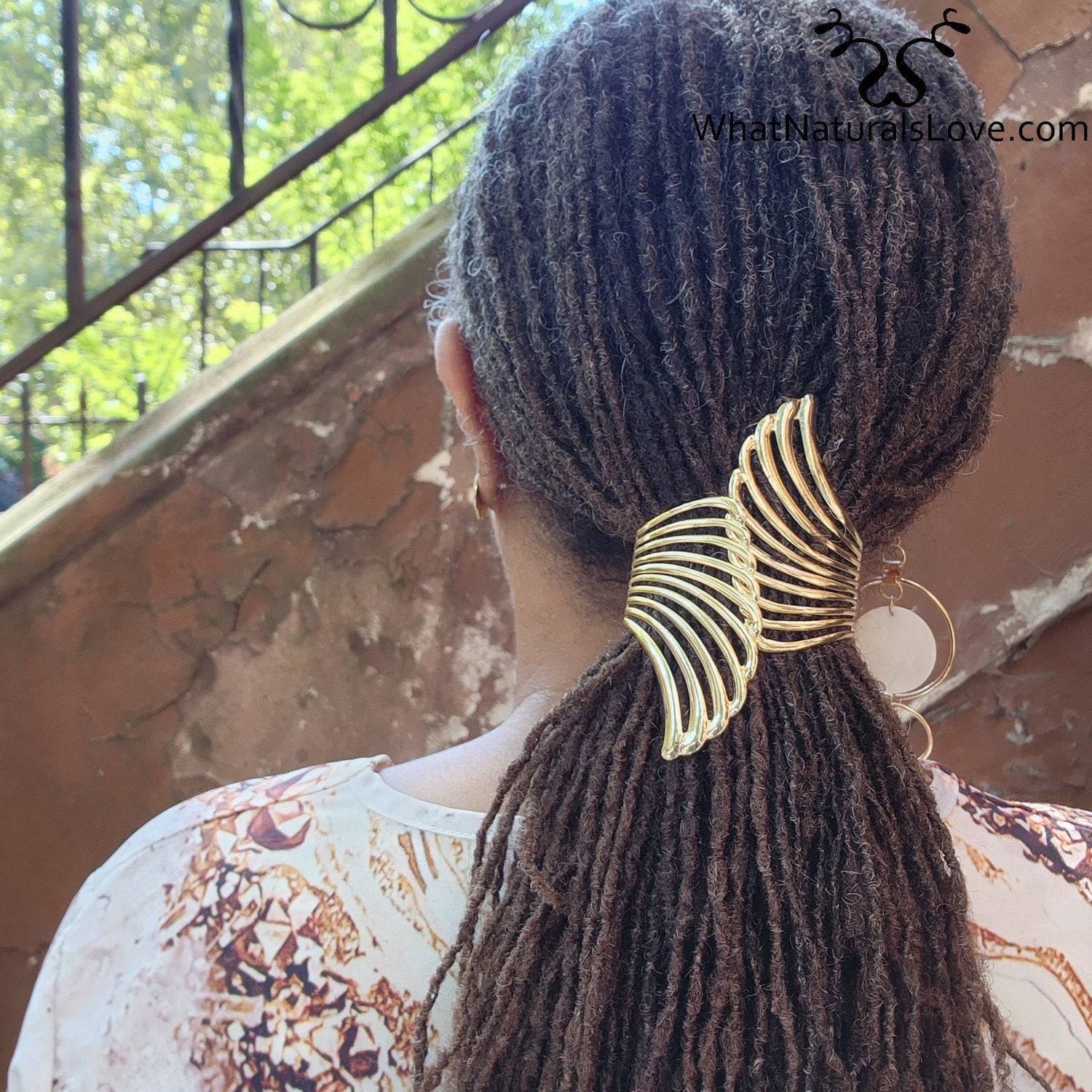 Close-up of Gold Aurora Wing Cuff in locs, highlighting its elegant wing-shaped design. Ideal for styling dreadlocks, sisterlocks, and braids.