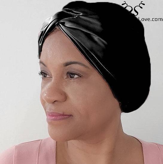 Silk Bonnet Amara De Luxe in sleek black, offering a stylish and protective solution for locs and natural hair. Made from 100% Mulberry Silk.